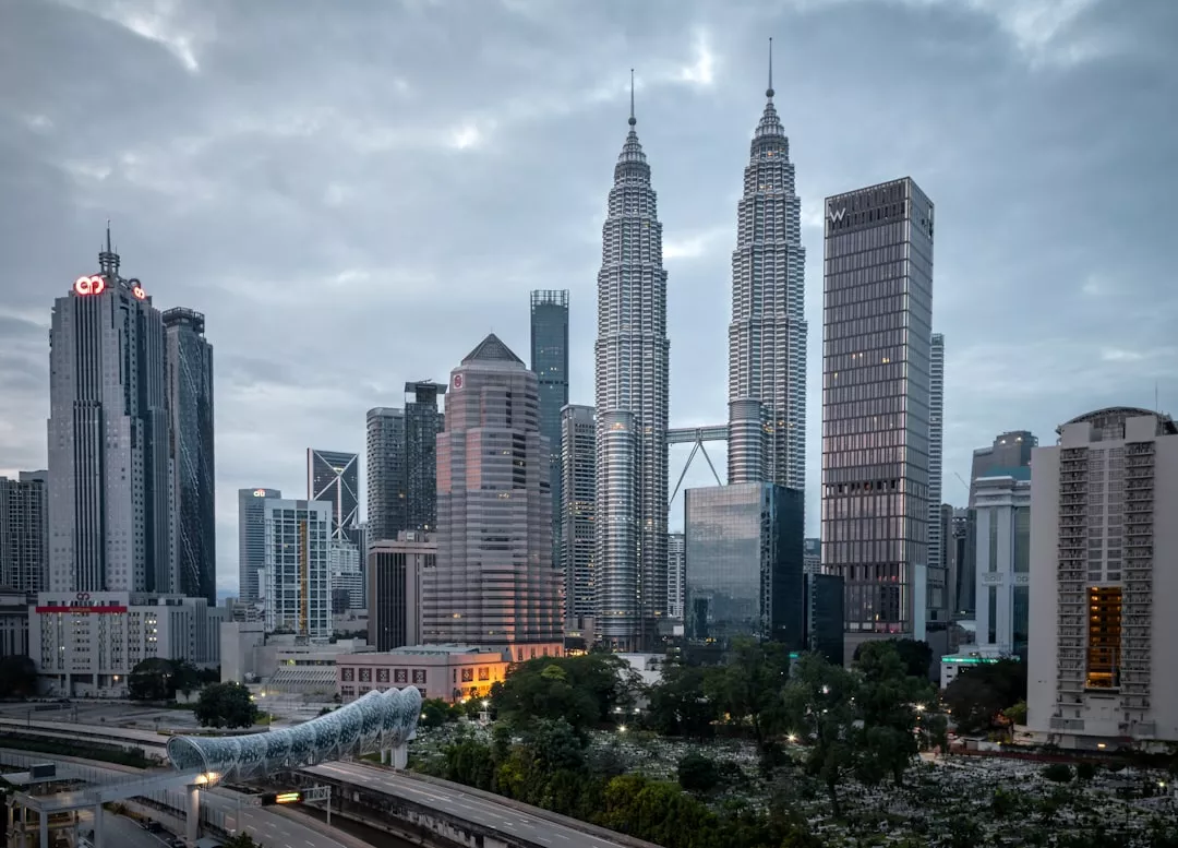 city buildings under white cloudy sky during daytime