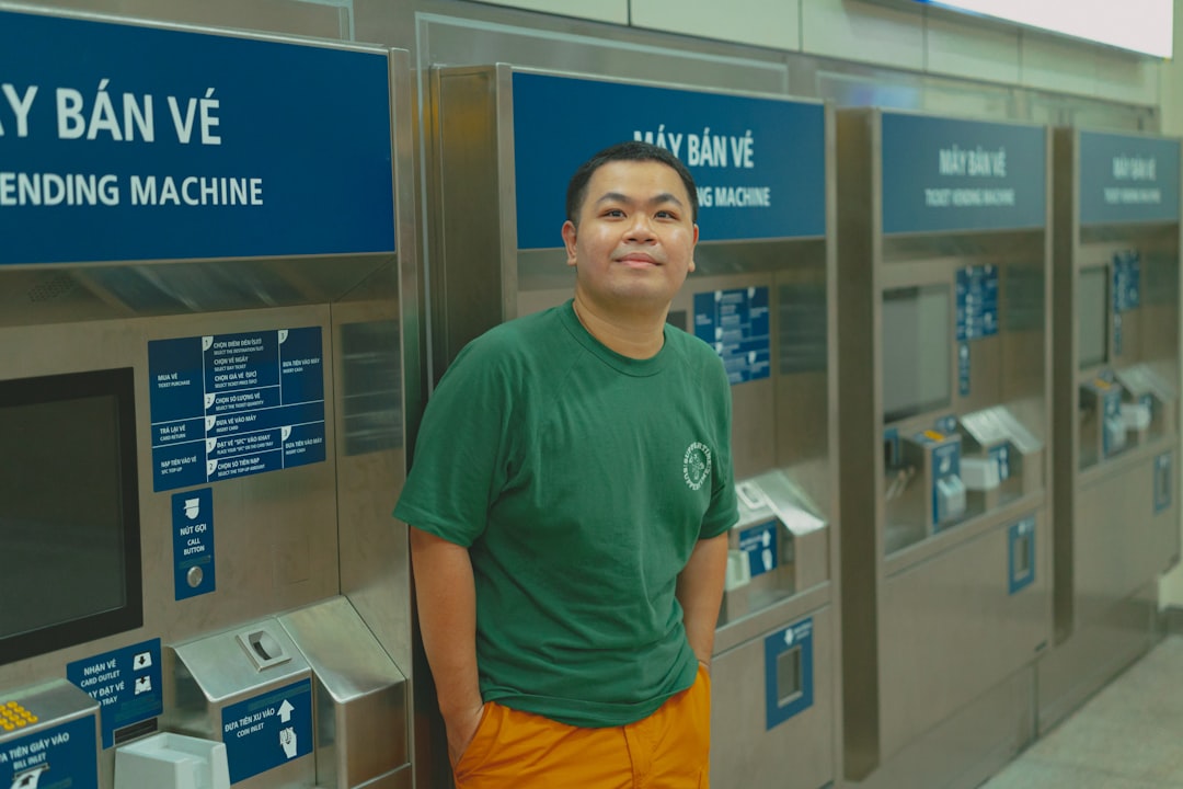 A man standing in front of a machine