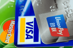 UnionPay, Visa, and Mastercard credit cards stacked together
