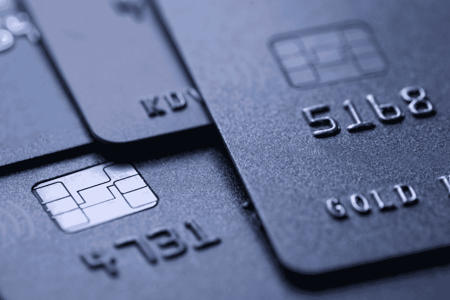 Close-up of metallic co-branded credit cards stacked together