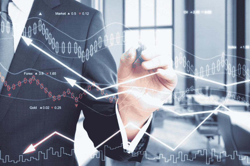 Businessman analyzing financial charts and currency market trends on a virtual screen.