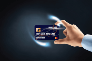Hand holding a glowing digital credit card with futuristic light effects